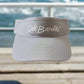 Gray visor with 'Salt Bandits' logo on a dock by the water